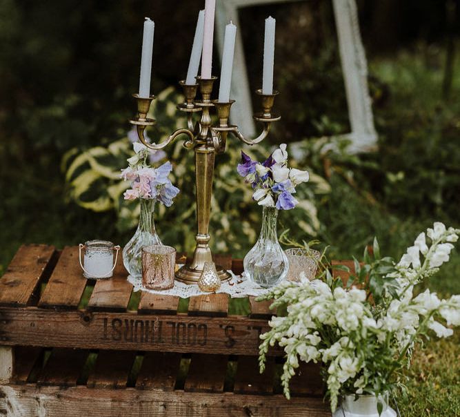 Wooden Pallets Decorated with Miniature Milk Churns, and Brass Candelabra