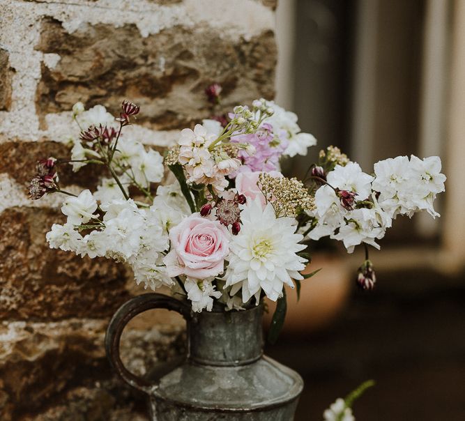 Metal Jug Filled with Wild Wedding Flowers