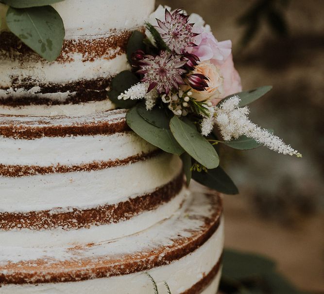 Semi Naked Wedding Cake Decorated with Fresh Flowers