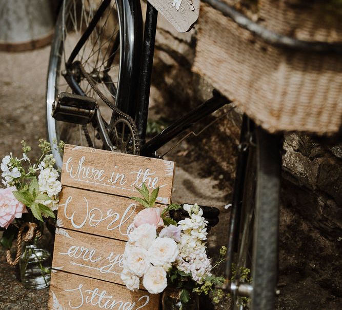 Wooden Table Plan Sign Tied to Vintage Bicycle