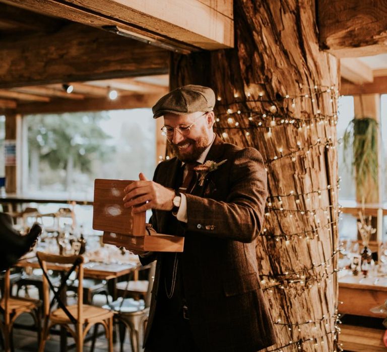 Groom opens present before wedding