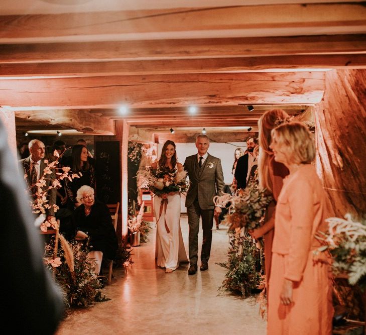 Bride walks down the aisle at wedding venue in Kent