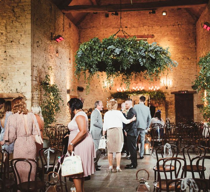 Cripps Barn Wedding Venue with Greenery Chandelier and Arrangements