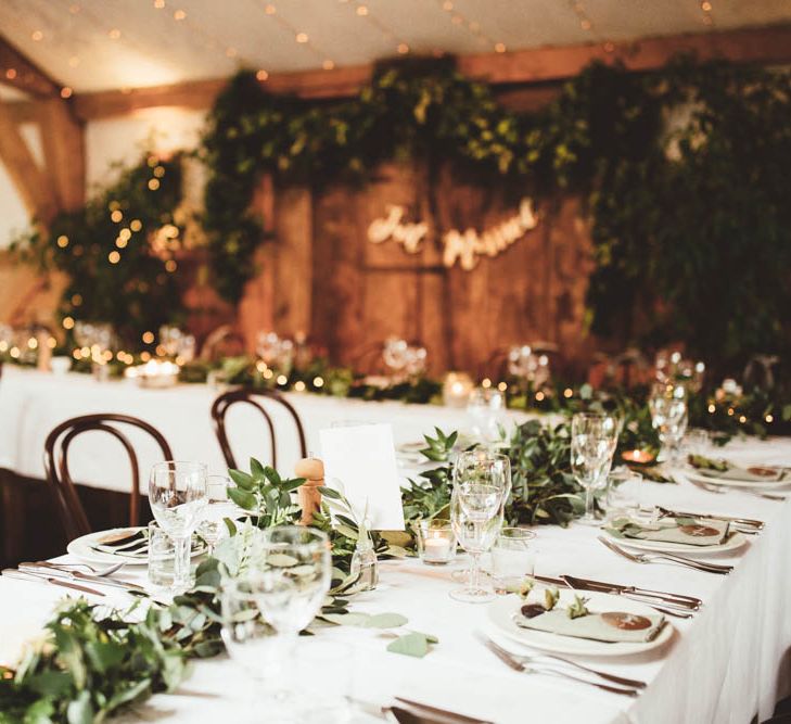 Wedding Reception Decor with Greenery Table Runner and Top Table Back Drop with Copper Just Married Bunting