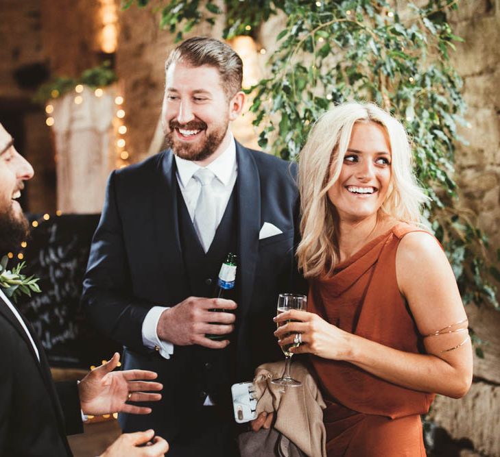 Wedding Guests Laughing Together