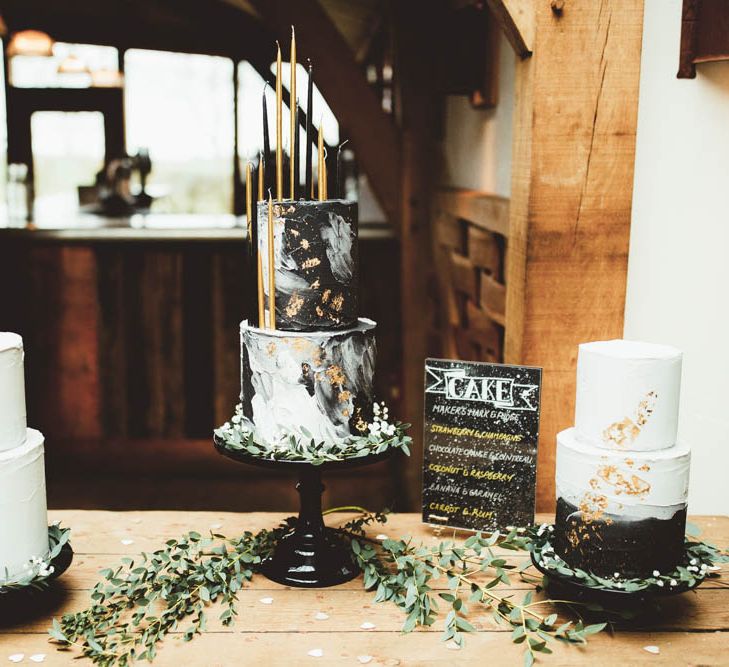 Three Celestial Wedding Cakes with Monochrome and Gold Decor and Tall Candles