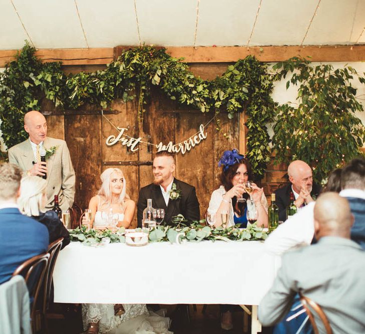 Top Table Greenery Back Drop and Copper Just Married Bunting