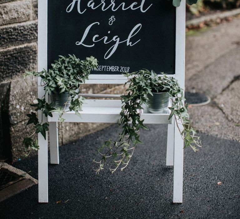 Chalkboard wedding sign outside the church ceremony