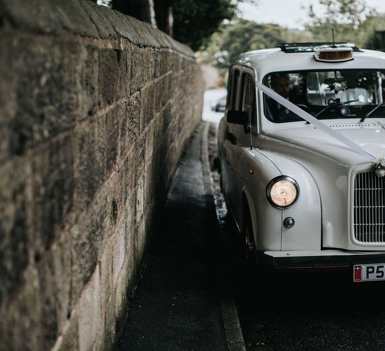 White taxi to transport the bridal party in multiway bridesmaid dresses