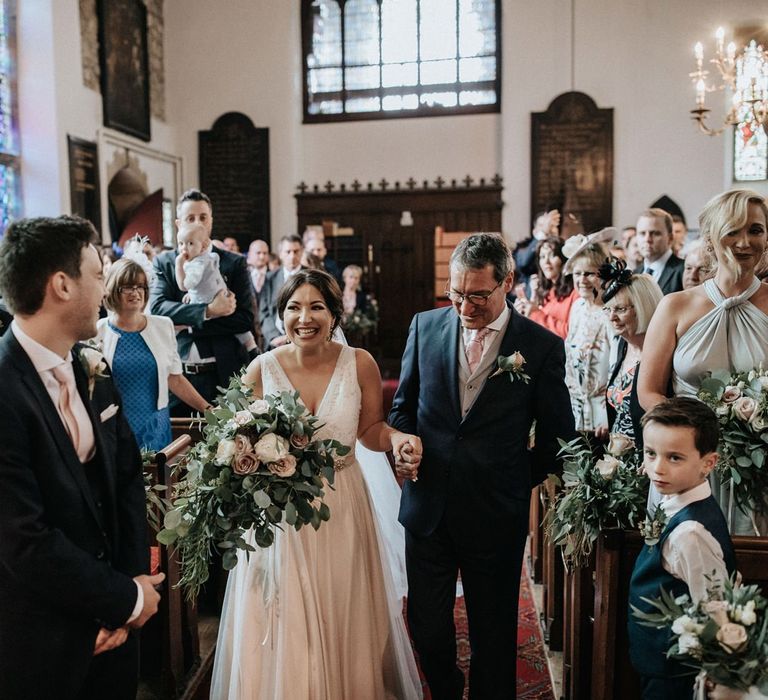 Church wedding ceremony with bride in Catherine Deane wedding dress