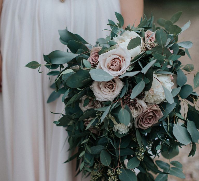 Bridal bouquet with pink roses, eucalyptus and sweet september's.