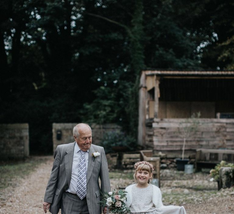 Flower girl in grey, silver and white outfit and multiway bridesmaid dresses