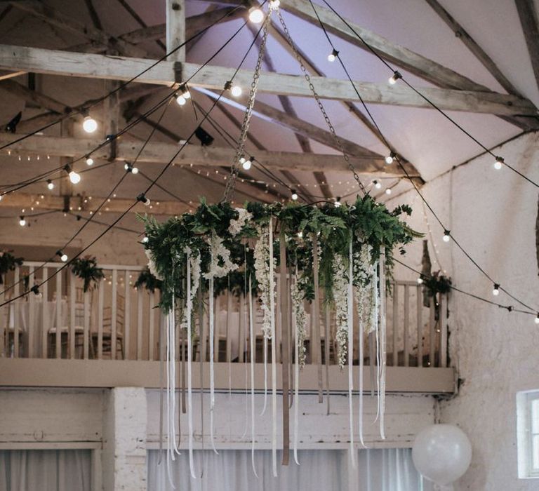 Hanging foliage chandelier with ribbon detail