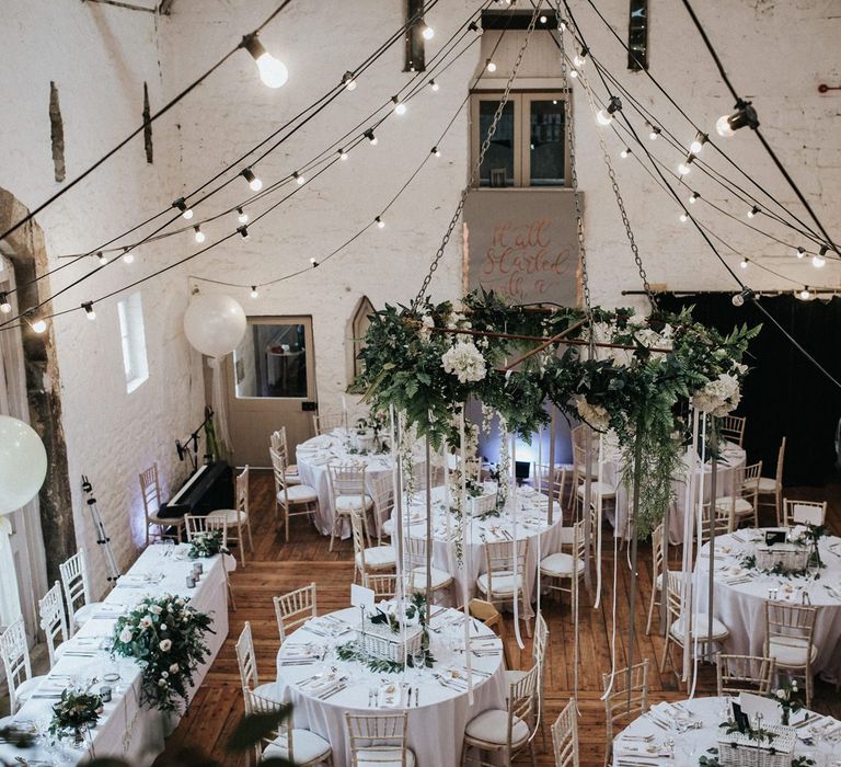 Festoon lights in contemporary barn wedding venue