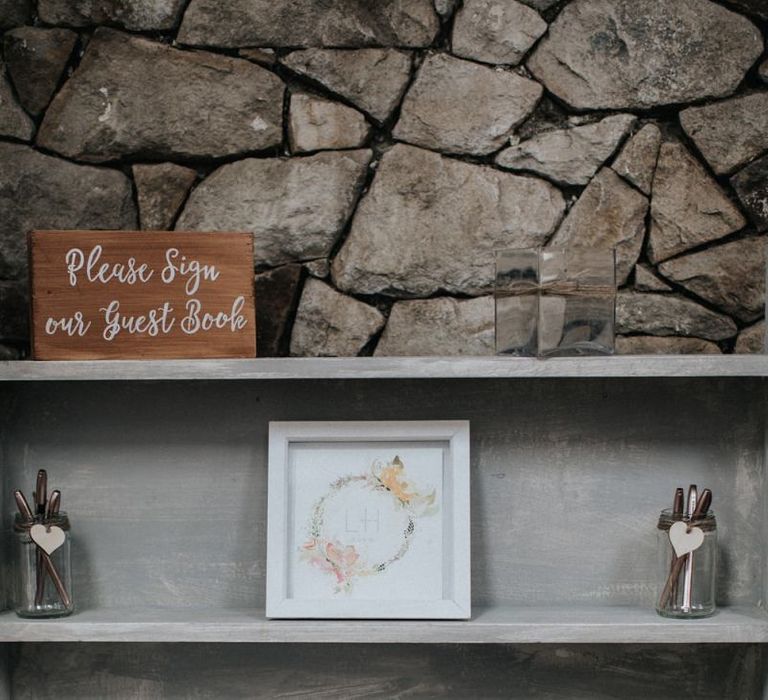 Guest book wedding station with finger print tree picture.