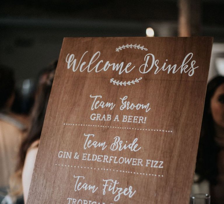 Wooden welcome drinks cocktail menu for wedding with multiway bridesmaid dresses