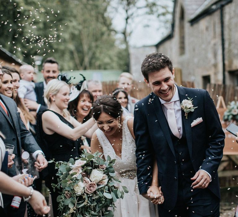 Bride and Groom confetti moment with Shropshire biodegradable petals