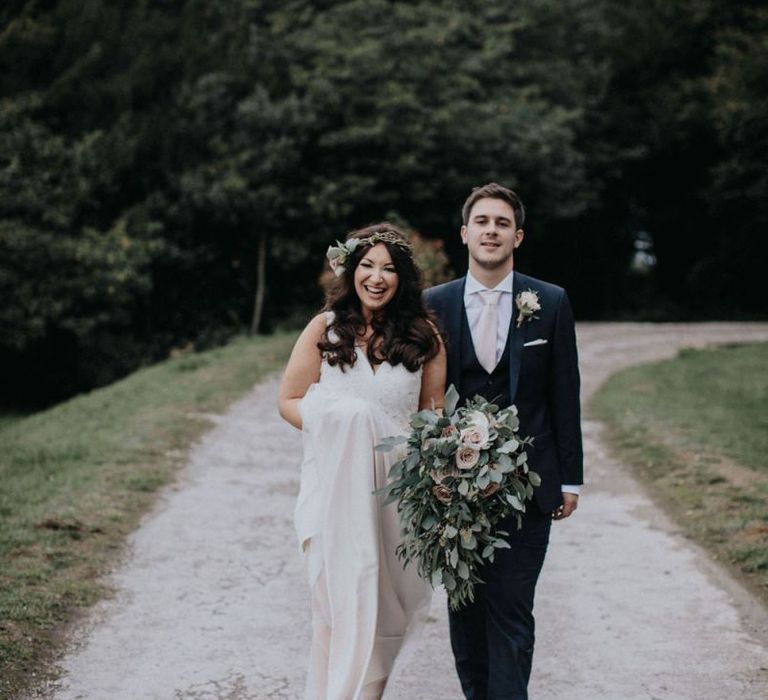 Bride in Catherine Deane wedding dress and Harriet Wilde wedding shoes