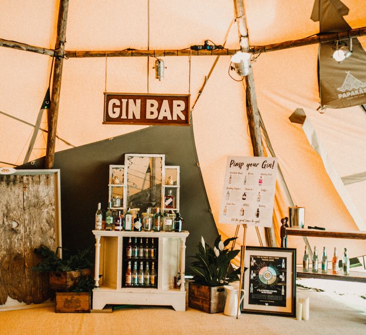 Gin Bar At Wedding // Bride In The Row For Bohemian Wedding In The Cotswolds With PapaKata Tipi And Ceremony At Merriscourt With Images From Carla Blain Photography