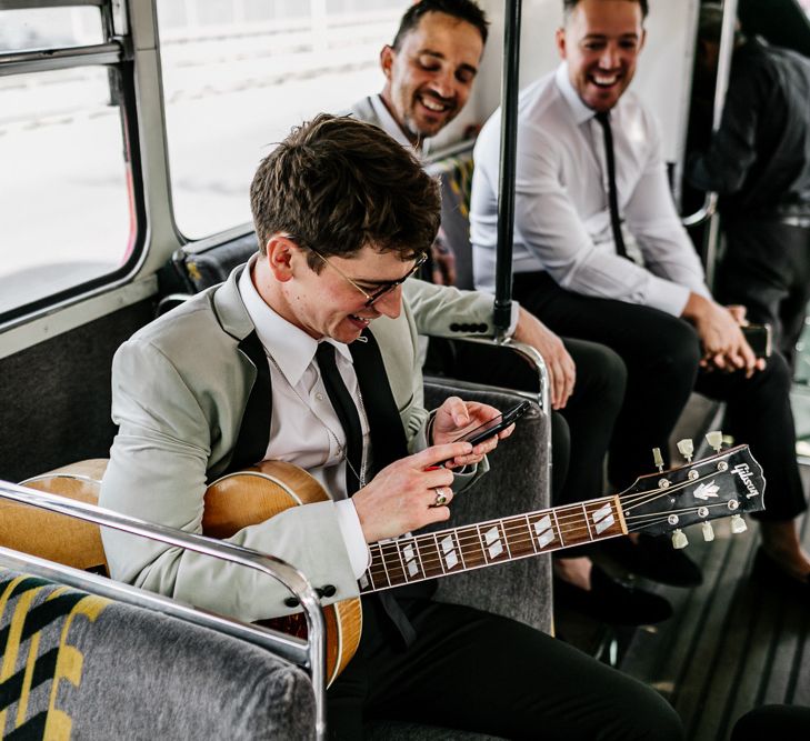 Groomsman Playing Guitar on a London Double Decker Bus