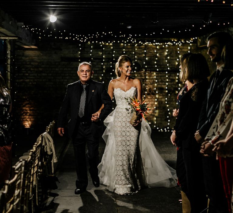 Bride Walking Down the Aisle in Lace Applique Tara Keely Wedding Dress