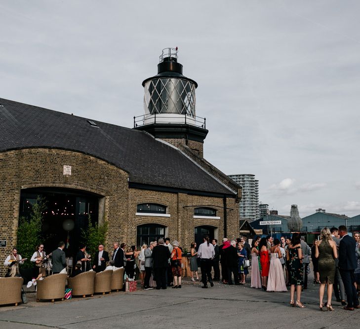 Wedding Guests Outside Trinity Buoy Wharf London Wedding Venue