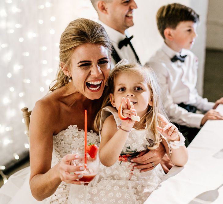 Happy Bride and Flower Girl Enjoying the Wedding Breakfast