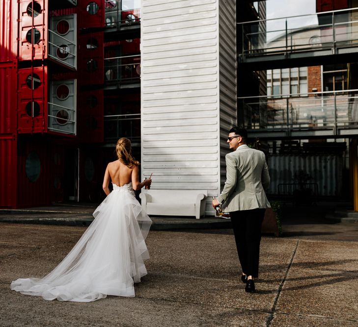 Bride in Tara Keely Applique Wedding Dress and Groom in Grey Tuxedo Jacket