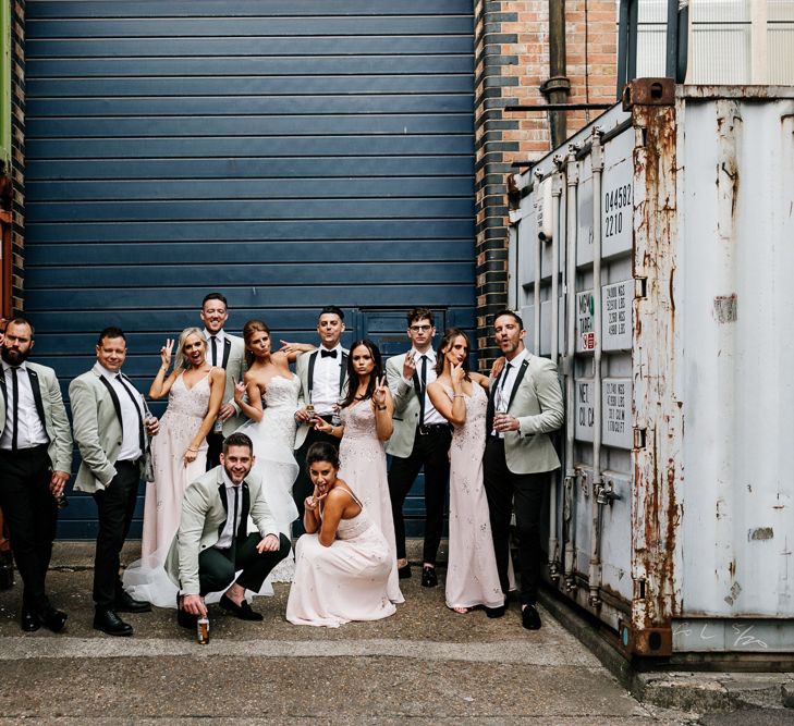 Wedding Party Portrait with Stylish Groomsmen in Black Trousers with Grey Tuxedo Waistcoats, Bridesmaids in Pink Strappy Dresses and Bride in Lace Tara Keely Wedding Dress