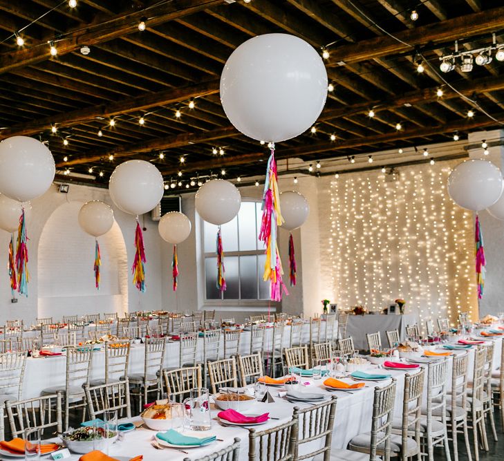 Trinity Buoy Wharf Warehouse Wedding with Giant Balloons with Colourful Tassels Wedding Decor