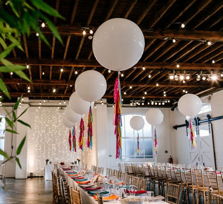 Bright Wedding Decor with Coloured Napkins and Tissue Tassels on Giant Balloons