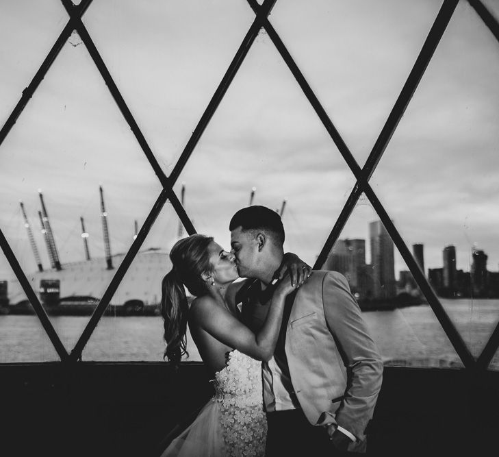 Bride and Groom Kissing in Front of the O2 Arena in London