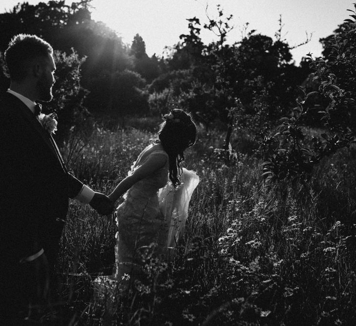 Bride in  Appliqué Flowers Yolan Cris ‘Espino’ Wedding Dress | Groom in Grey's Suit Hire | Pre-Raphaelite Mood Wedding at Heaver Castle in Kent | Carla Blain Photography