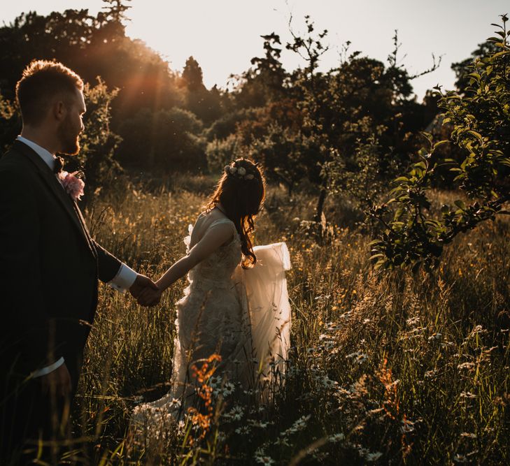 Bride in  Appliqué Flowers Yolan Cris ‘Espino’ Wedding Dress | Groom in Grey's Suit Hire | Pre-Raphaelite Mood Wedding at Heaver Castle in Kent | Carla Blain Photography