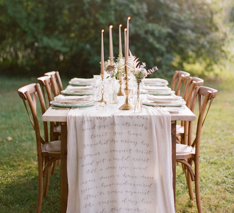 Tapered candle and scripted table runner | Bespoke Planning and Styling by Helaina Storey Wedding Design | Image by Katy Lunsford