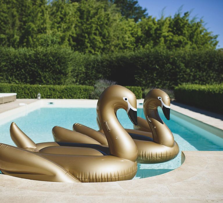 Gold swan inflatables at wedding | Bespoke Planning and Styling by Helaina Storey Wedding Design | Image by Rik Pennington