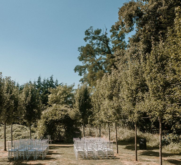 Outdoor tree lined aisle | Bespoke Planning and Styling by Helaina Storey Wedding Design | Image by Alice Cunliffe Photography