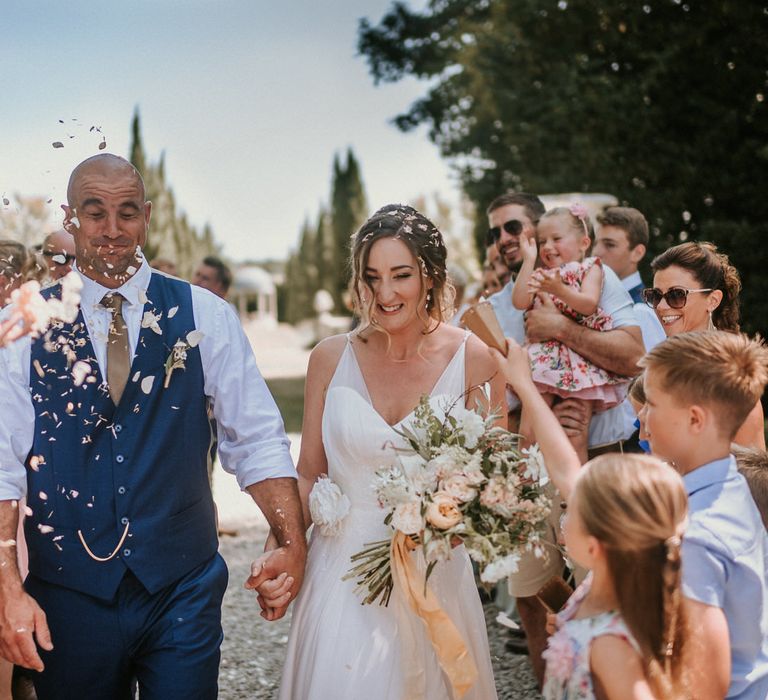 Outdoor wedding confetti shot | Bespoke Planning and Styling by Helaina Storey Wedding Design | Image by Alice Cunliffe Photography