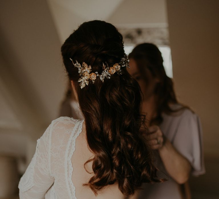 Half up half down wedding hair with floral headdress