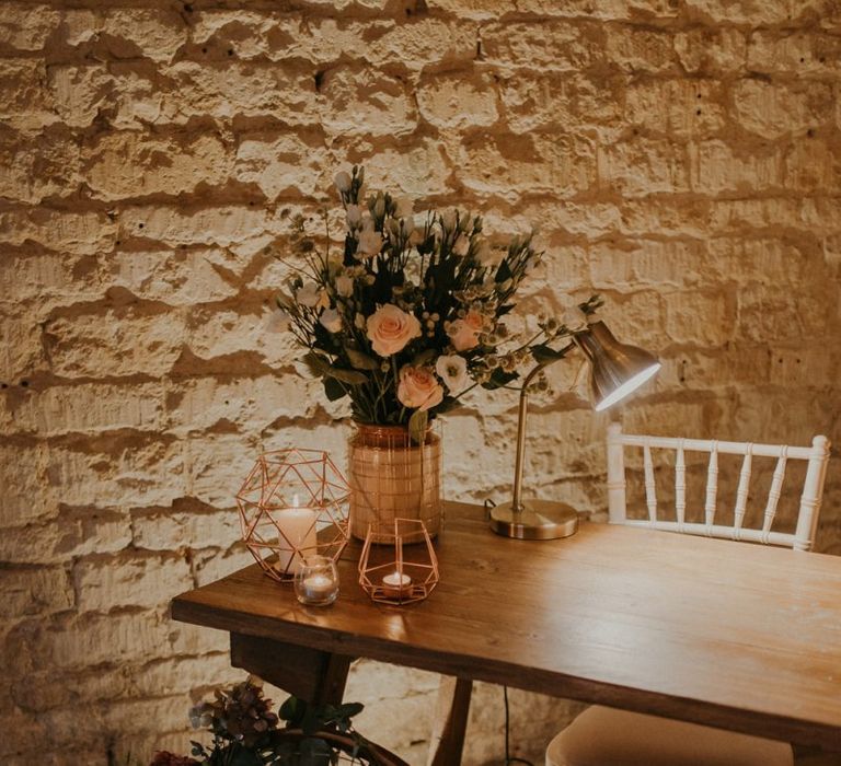 Register table with rustic wedding decor and candles at Lapstone Barn