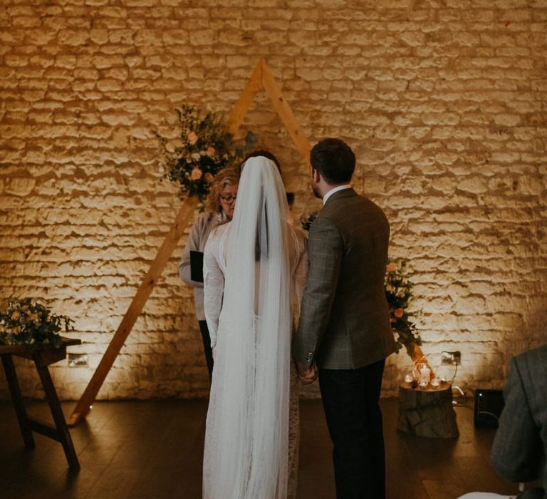 Bride and groom standing at the altar at Lapstone Barn