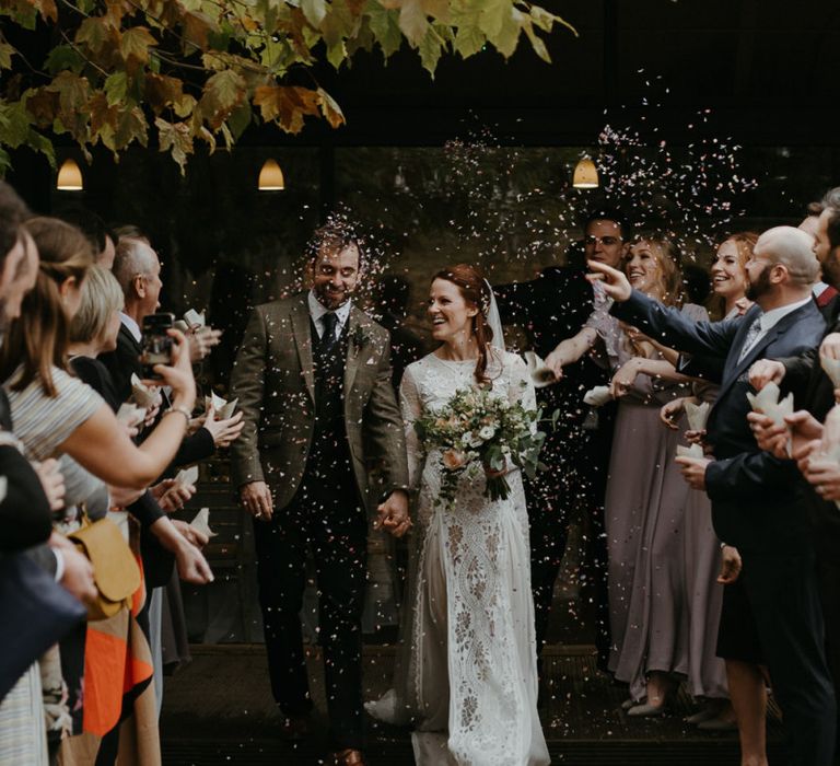 Confetti moment at Lapstone Barn with bride in Inca Grace Loves Lace dress