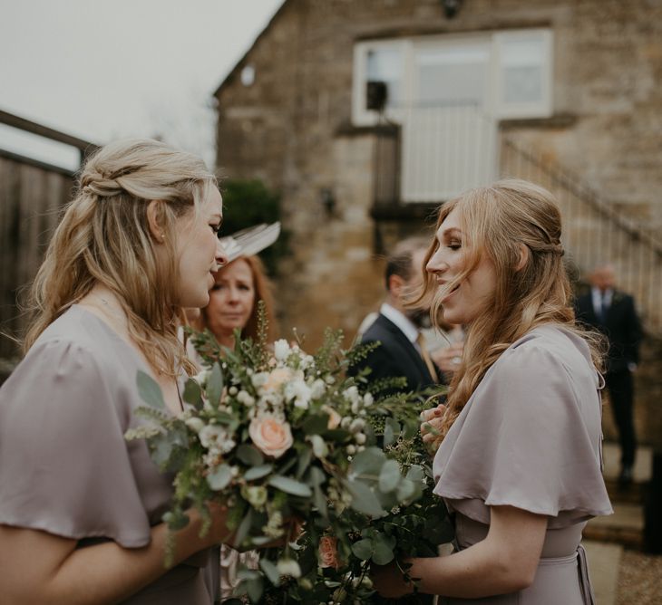 Bridesmaids in ReWritten Florence dresses in concrete shade