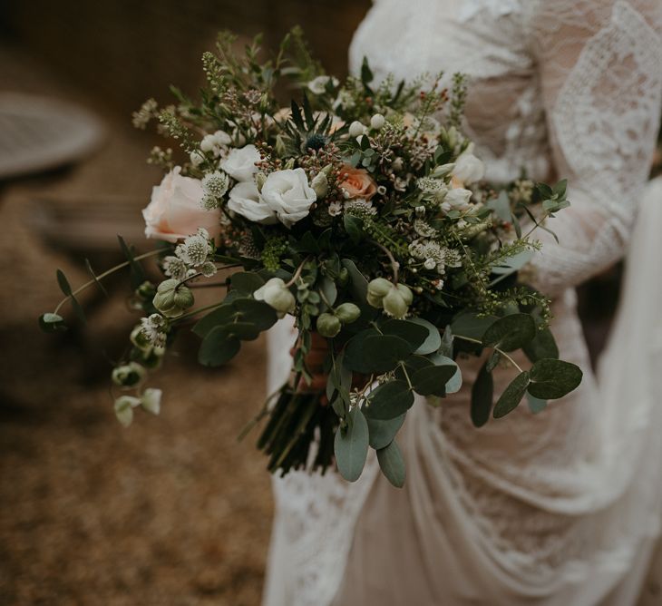 Green, white and peach wedding bouquet for winter wedding