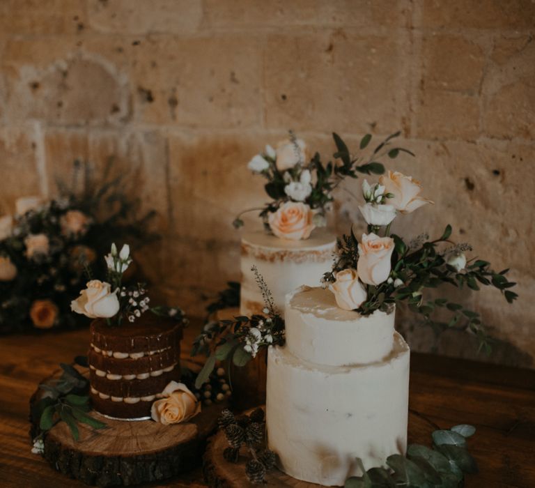 Dessert table with individual cakes on tree slices