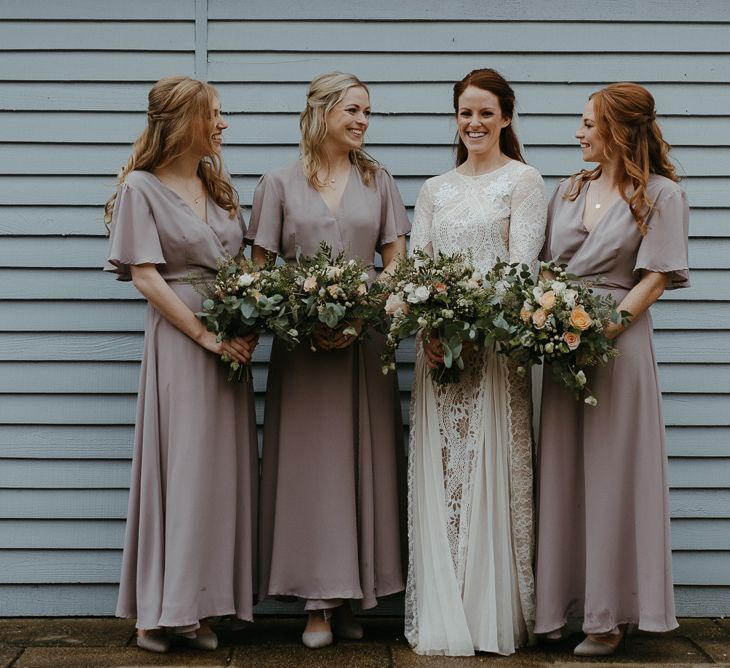 Bridal party portrait with bridesmaids in ReWritten dresses