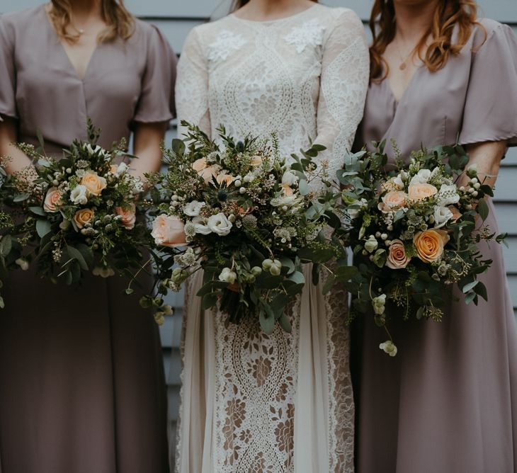 Peach and white flower bouquets with foliage