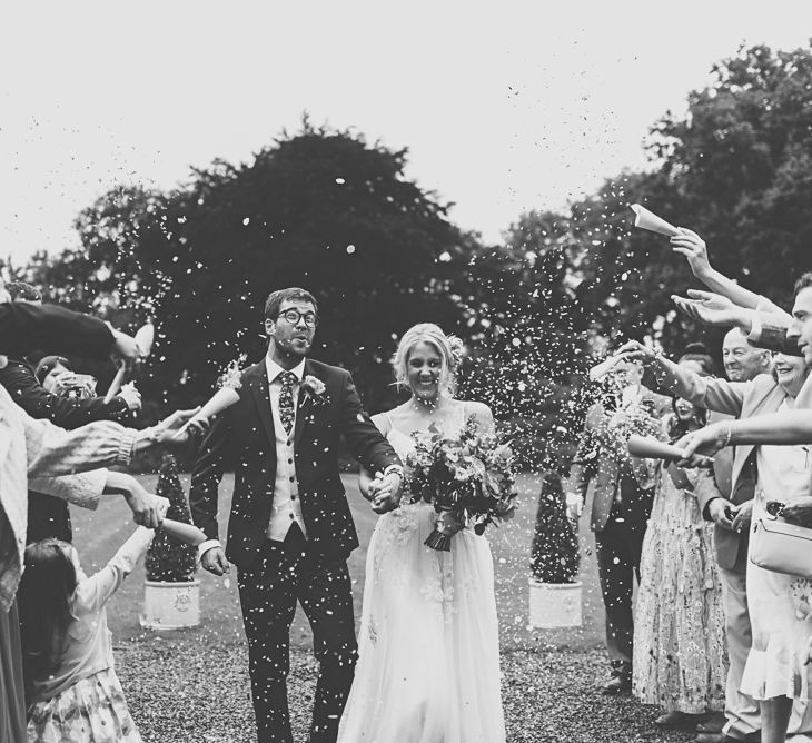 Confetti Moment | Bride in MiaMia Spagetti Strap Bridal Gown | Groom in Next 3-piece Suit | DIY Bright Family Wedding at Plas Glansevin in Carmarthenshire, Wales |  O&amp; C Photography