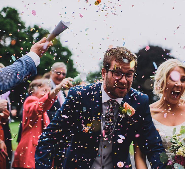 Confetti Moment | Bride in MiaMia Spagetti Strap Bridal Gown | Groom in Next 3-piece Suit | DIY Bright Family Wedding at Plas Glansevin in Carmarthenshire, Wales |  O&amp; C Photography