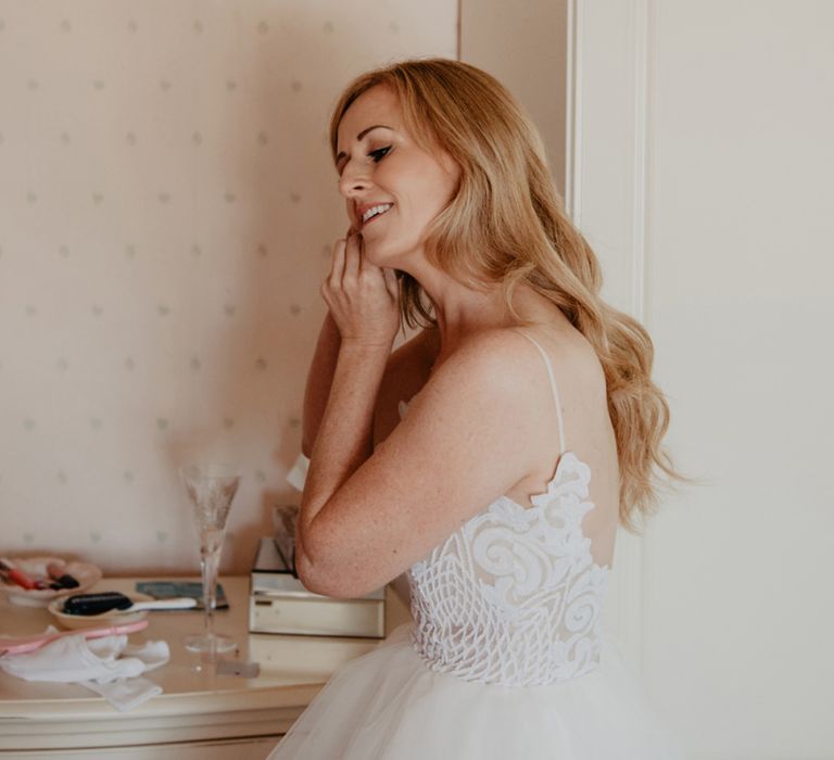 Bridal preparations for wedding with Prosecco wall